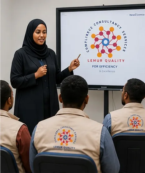 Staff in Lemur Quality vests attending a training presentation